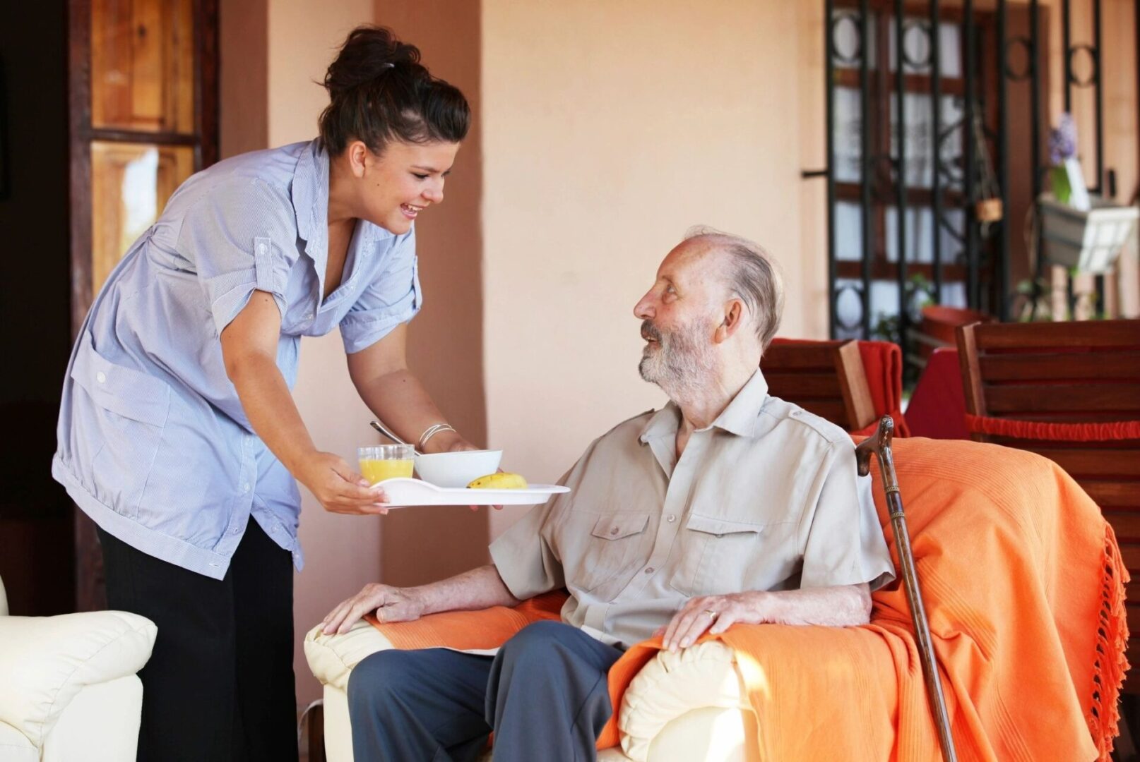 Nurse giving food to patient